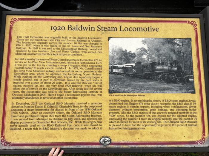 An interpretive plaque headed 1920 Baldwin Steam Locomotive, with several paragraphs of text and a black and white photograph of the engine in service on the Mississippian Railway.